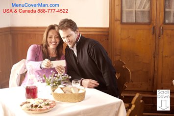 Happy couple at restaurant taking a selfie.  Menu jackets that are beautifully imprinted for your restaurant.